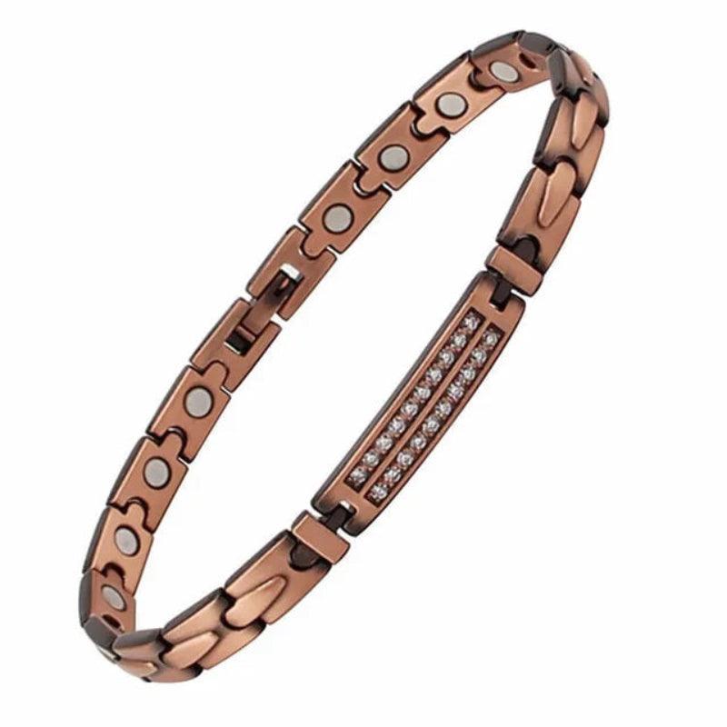 Rose gold bracelet with magnetic elements on a white background