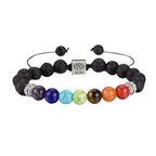 Chakra beaded bracelet with black stones and colorful beads on a white background