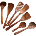 Set of wooden cooking utensils on a white background