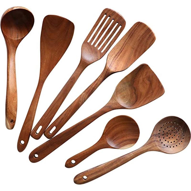 Set of wooden cooking utensils on a white background