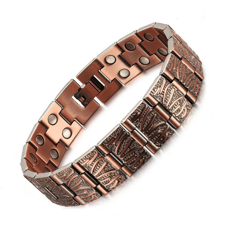 Copper bracelet with intricate design on a white background