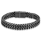 A men's braided chain link bracelet in a dark gunmetal gray finish, featuring a rectangular clasp, shown on a clean white background.