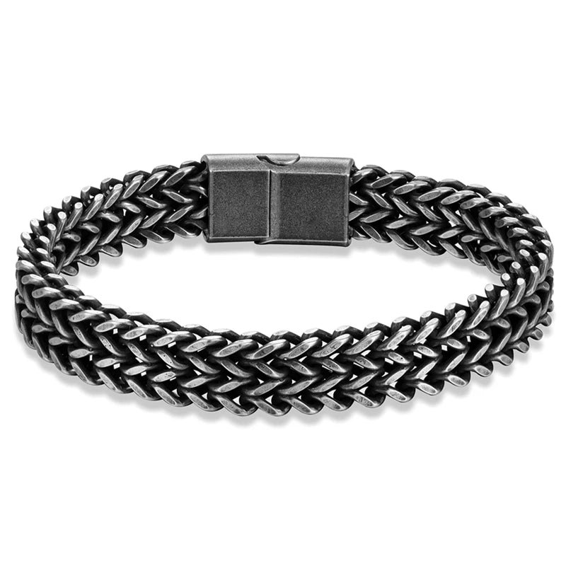 A men's braided chain link bracelet in a dark gunmetal gray finish, featuring a rectangular clasp, shown on a clean white background.
