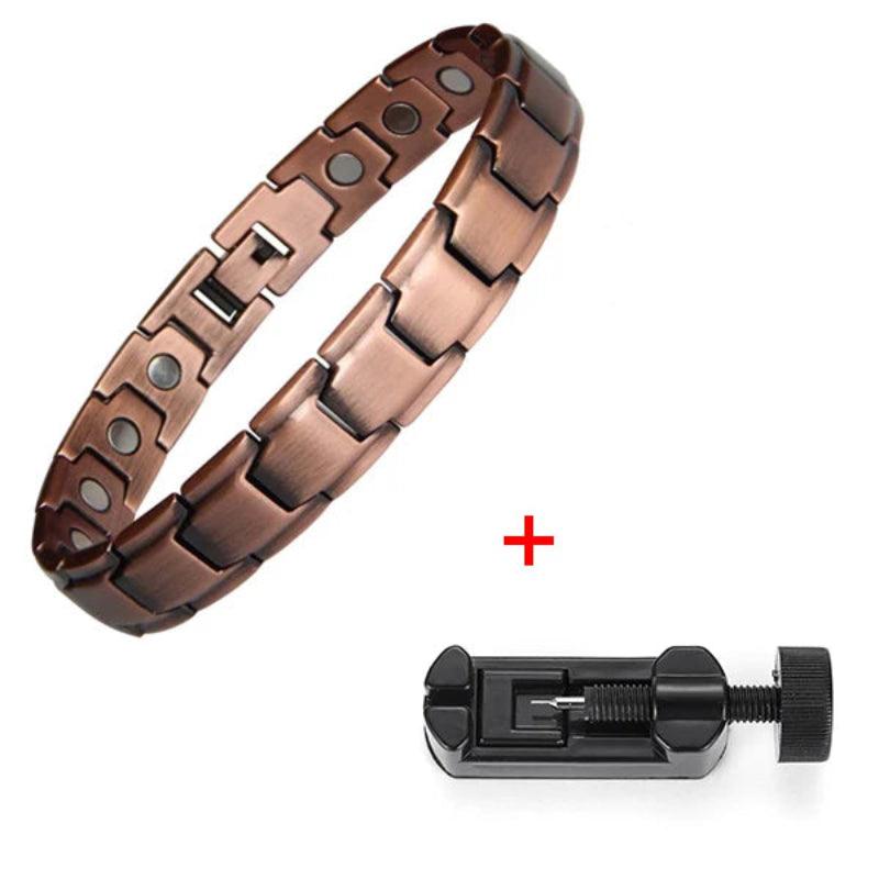 Copper bracelet with magnetic stones and a black tool on a white background