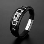 Black leather bracelet with silver metal clasp on a dark gray background