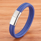 Blue braided bracelet with a silver clasp on a wooden surface