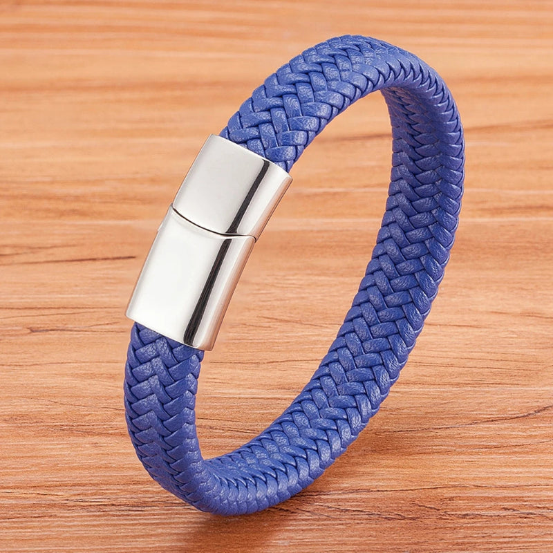 Blue braided bracelet with a silver clasp on a wooden surface