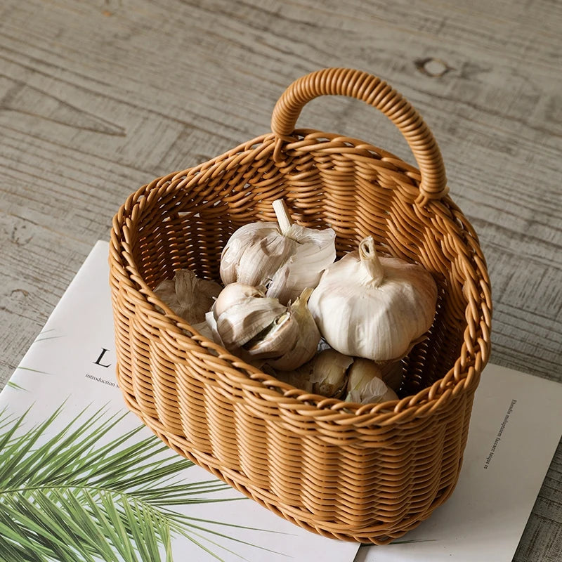 Wicker basket with garlic bulbs on a wooden surface
