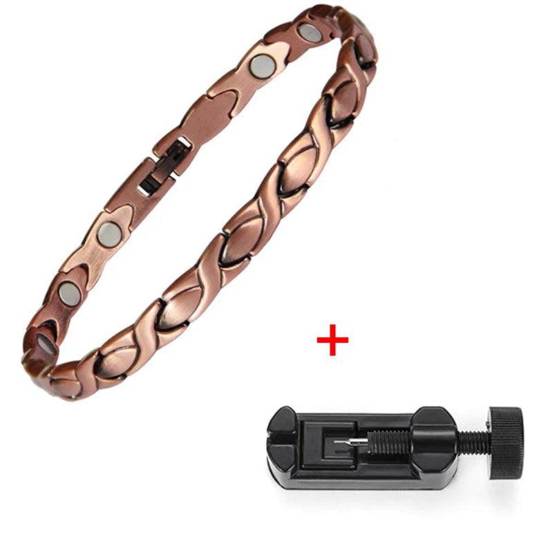 Rose gold bracelet with magnetic stones and a black tool on a white background