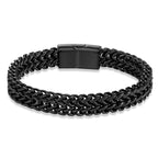 A black braided chain link bracelet with a matching matte black rectangular clasp, displayed on a clean white background.