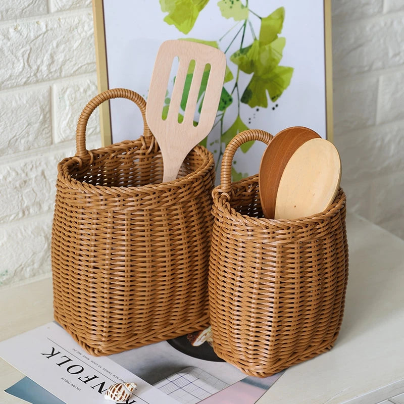 Two wicker baskets with wooden utensils on a surface with a light background