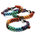 Set of colorful beaded bracelets on a white background