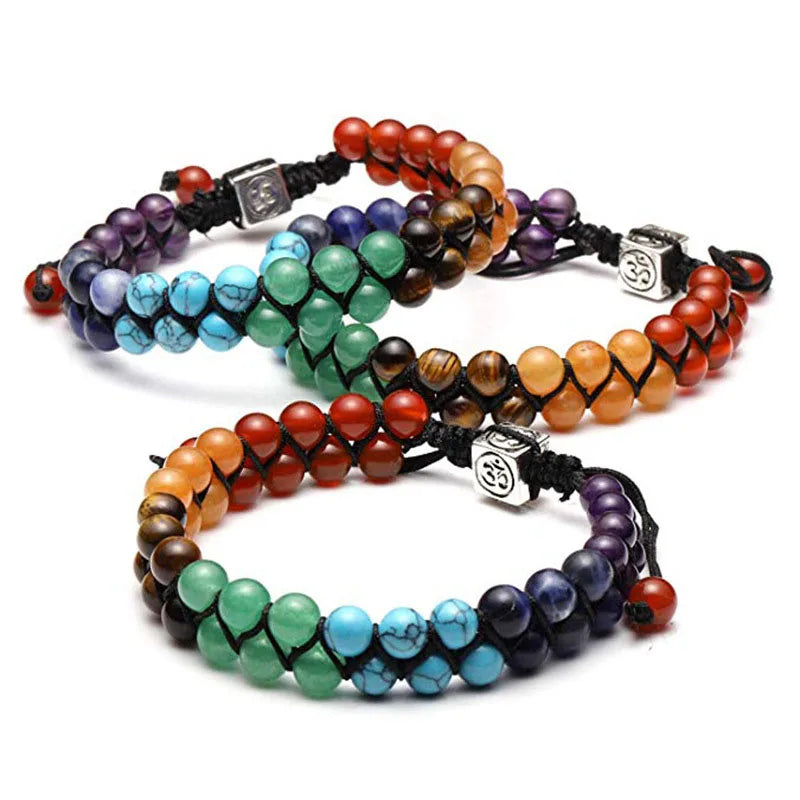 Set of colorful beaded bracelets on a white background