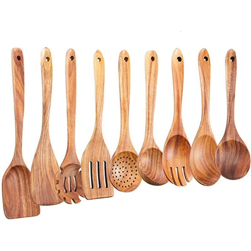 Set of wooden kitchen utensils including spoons and a spatula on a white background
