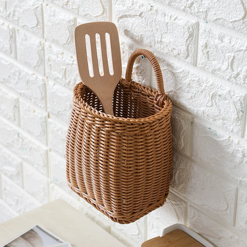 Wicker basket with wooden spatula against a white brick wall