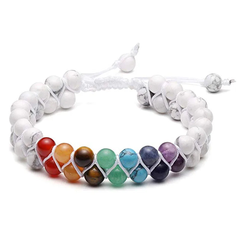 Multicolored beaded bracelet with white cord on a white background