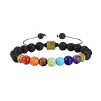 Multicolored beaded bracelet with black lava beads on a white background