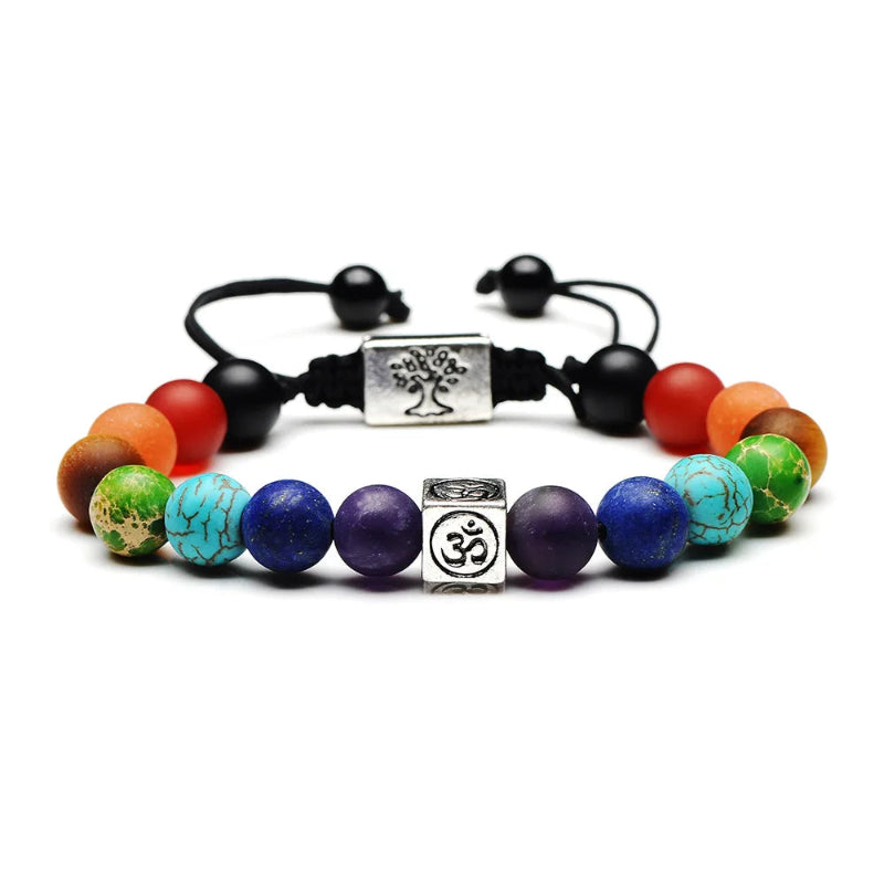 Multicolored beaded bracelet with black cord and silver charms on a white background