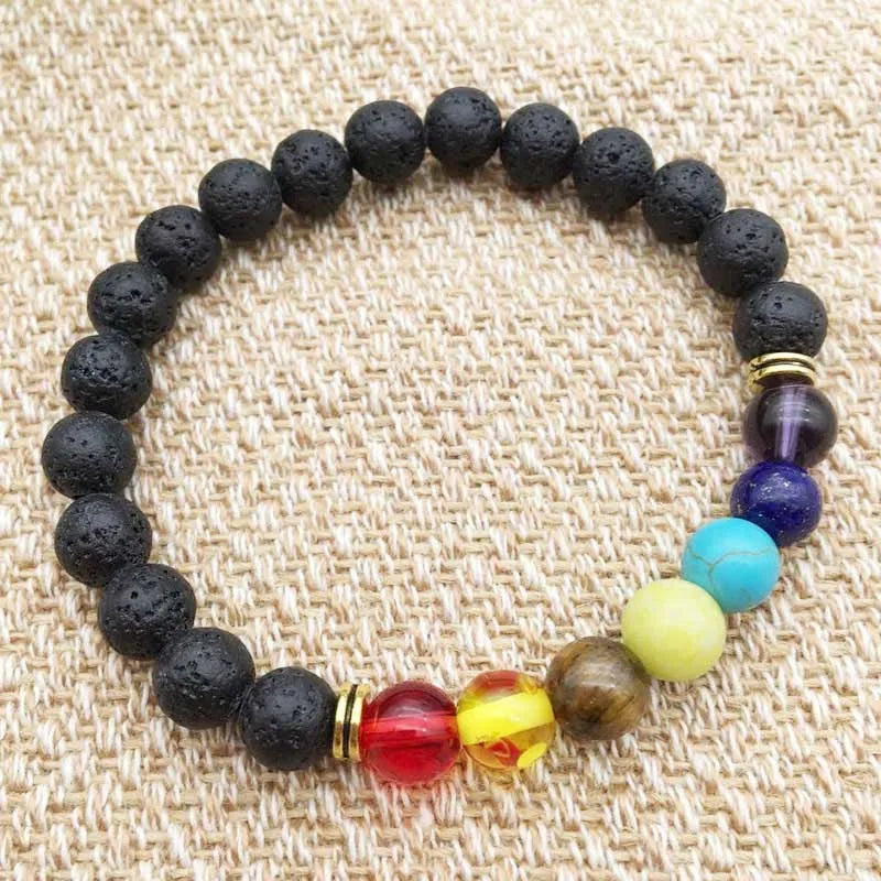 Black beaded bracelet with colorful beads on a textured beige background