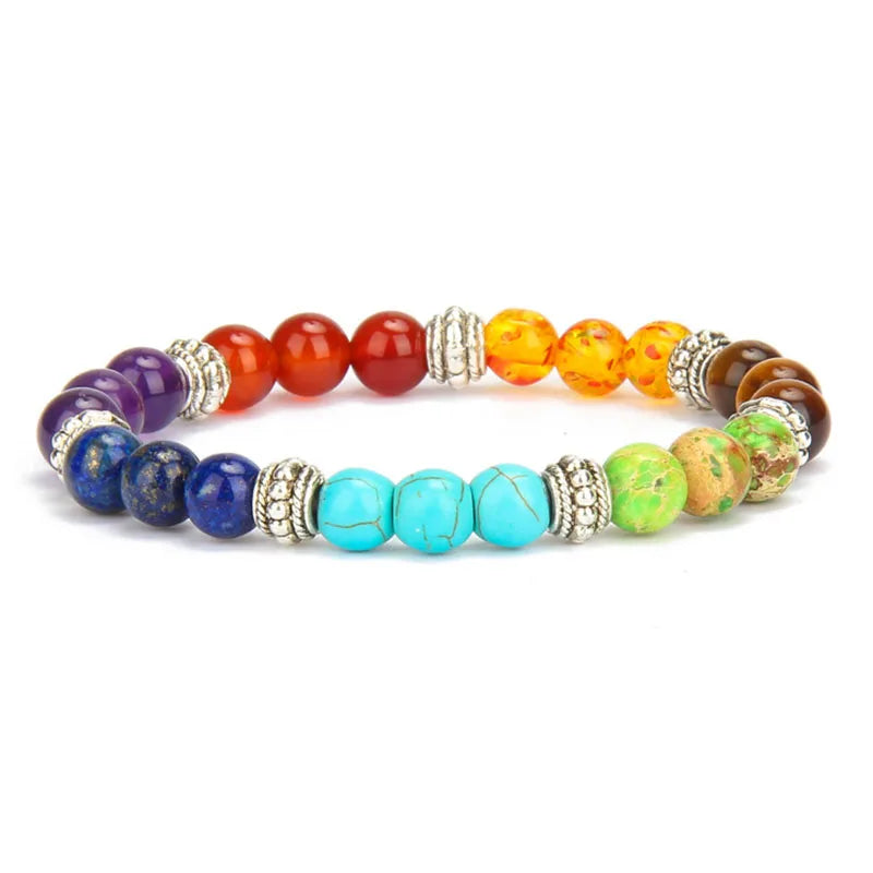 Multicolored beaded bracelet with gold accents on a white background