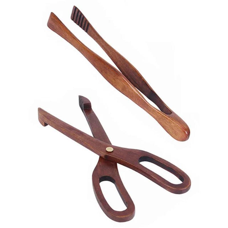 Wooden tongs with metal tips on a white background