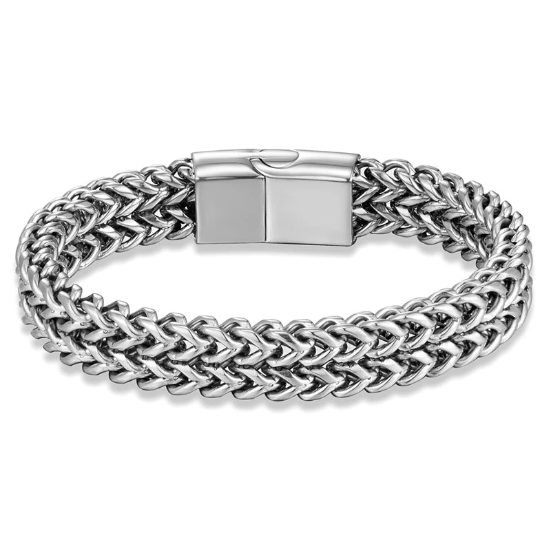 A silver-toned braided chain bracelet with a polished rectangular clasp, shown on a clean white background.