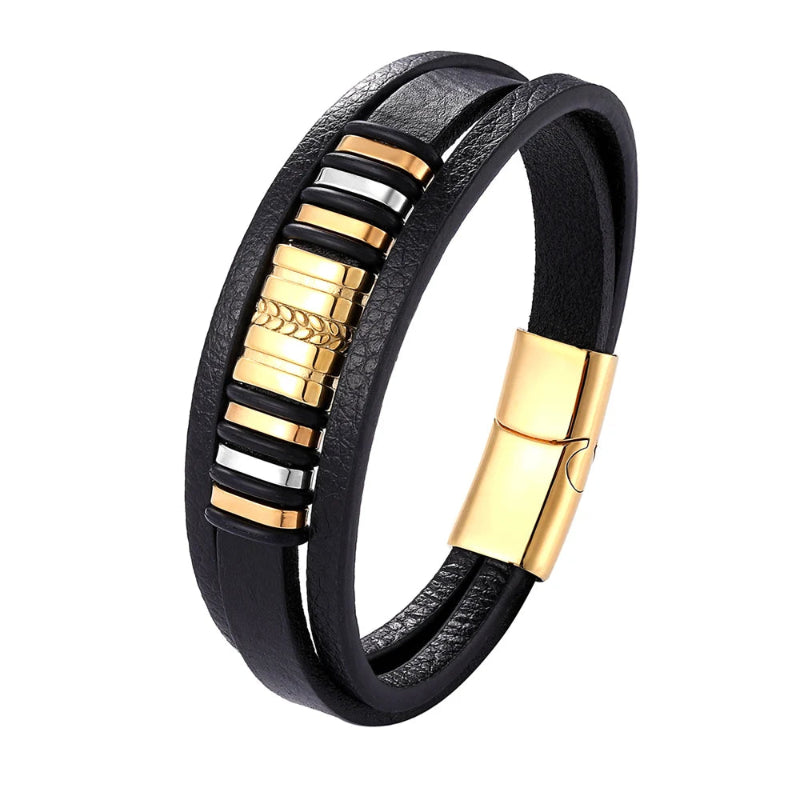 Black leather bracelet with gold and silver accents on a white background