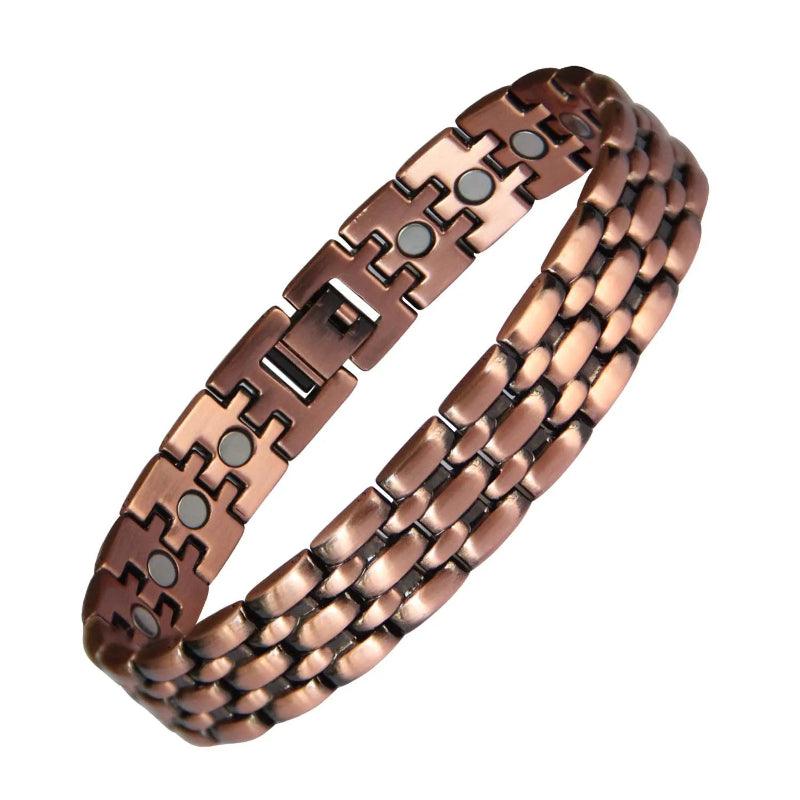 Copper bracelet with magnetic stones on a white background