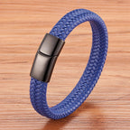Blue braided bracelet with a metallic clasp on a wooden surface