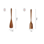 Two wooden paddles with measurements on a white background