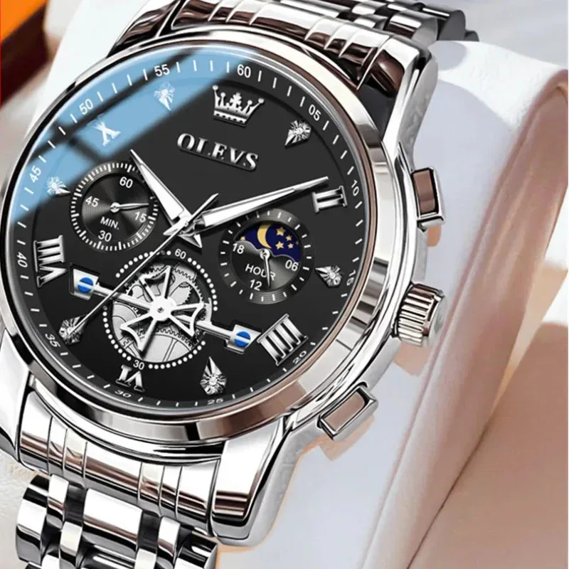 Silver wristwatch with black dial on a white background, featuring the OLEVS brand.