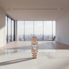 Rose gold watch with rectangular face on a white background, featuring the brand 'SANDA'.