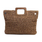 Brown woven handbag with wooden handles on a white background