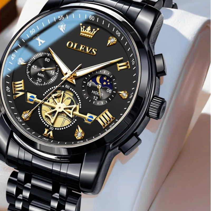 Black and gold OLEVS watch with detailed face on a white background