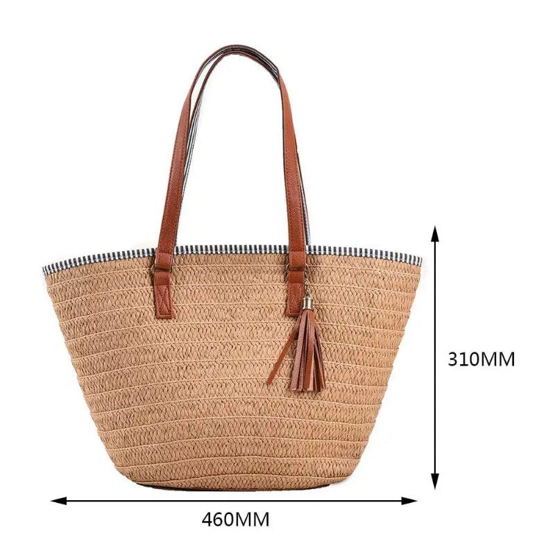 Beige straw tote bag with brown handles and tassel, shown with measurements on a white background.