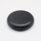 Black circular object on a white background