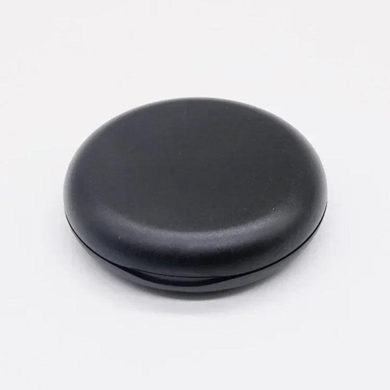 Black circular object on a white background