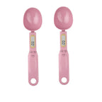 Two pink digital measuring spoons on a white background