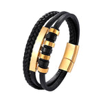 Black braided leather bracelet with gold metal clasps on a white background