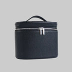Black leather travel case with a silver zipper on a white background
