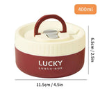 Red and beige lunch box with handle and 'Lucky' branding, showing dimensions on a white background.