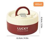 Red and beige lunch box with handle and 'Lucky' branding, showing dimensions on a white background.