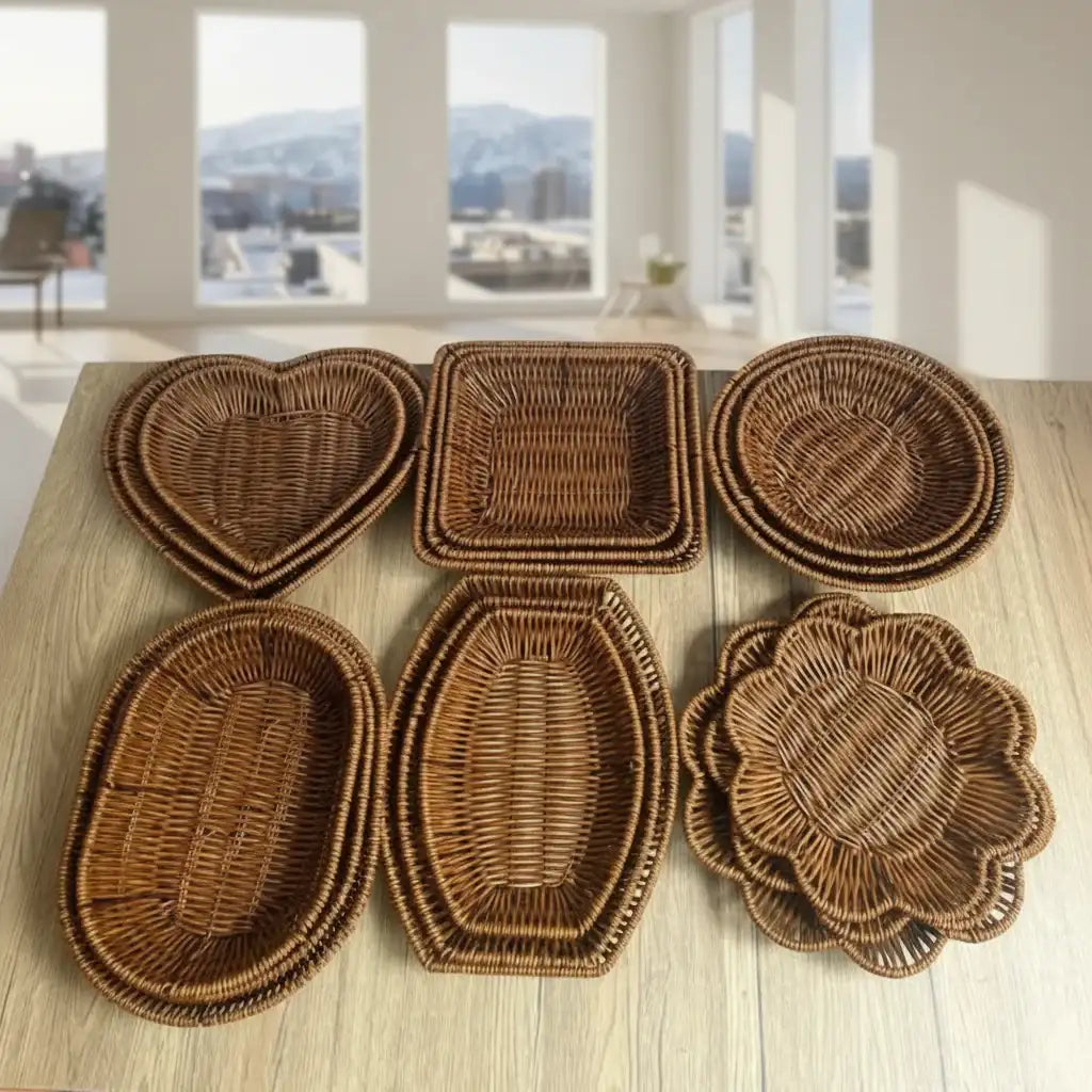 Set of wicker coasters with various shapes on a wooden surface