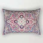 Decorative pillow with intricate paisley pattern on a plain background