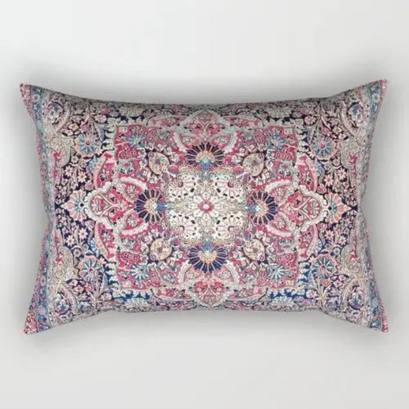 Decorative pillow with intricate paisley pattern on a plain background