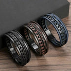 Three braided leather bracelets on a wooden surface with a dark gray background