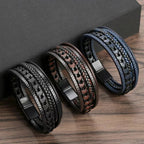 Three braided leather bracelets on a wooden surface with a dark gray background