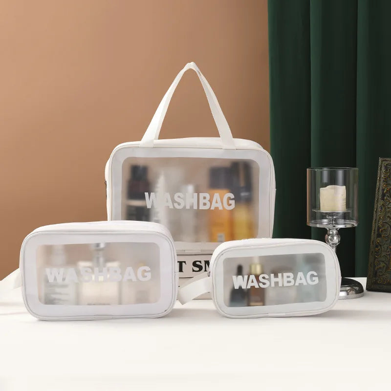 Set of clear wash bags with 'WASHBAG' text on a neutral background