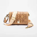 Beige handbag with gold accents on a white background
