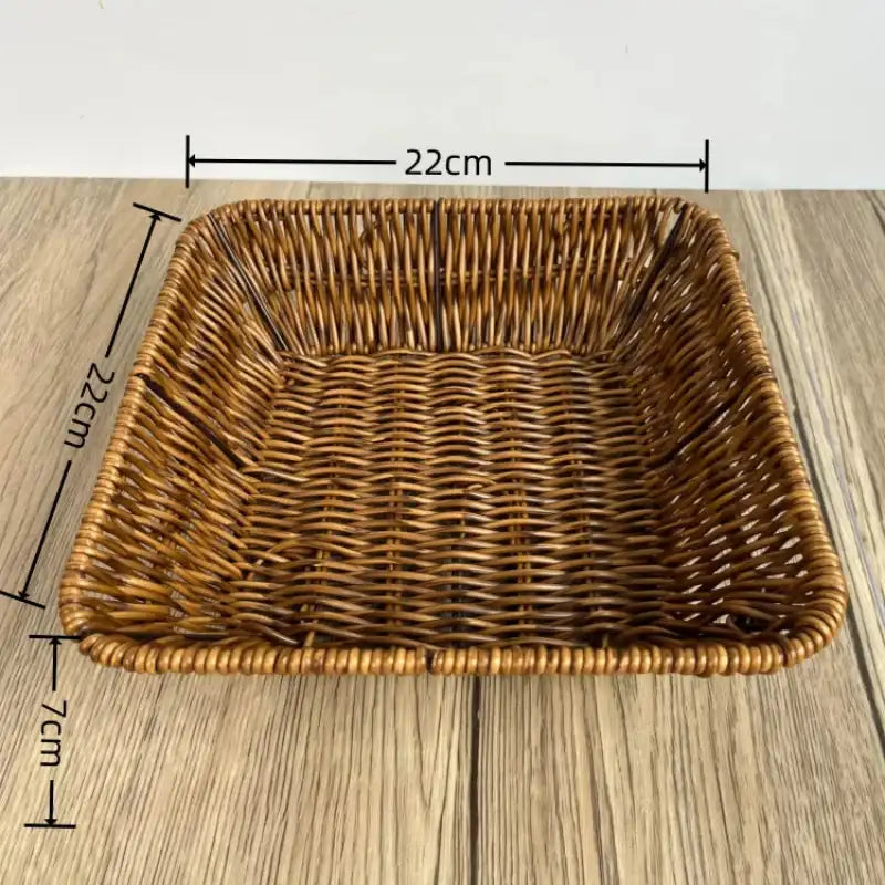 Woven brown basket with dimensions on a wooden surface